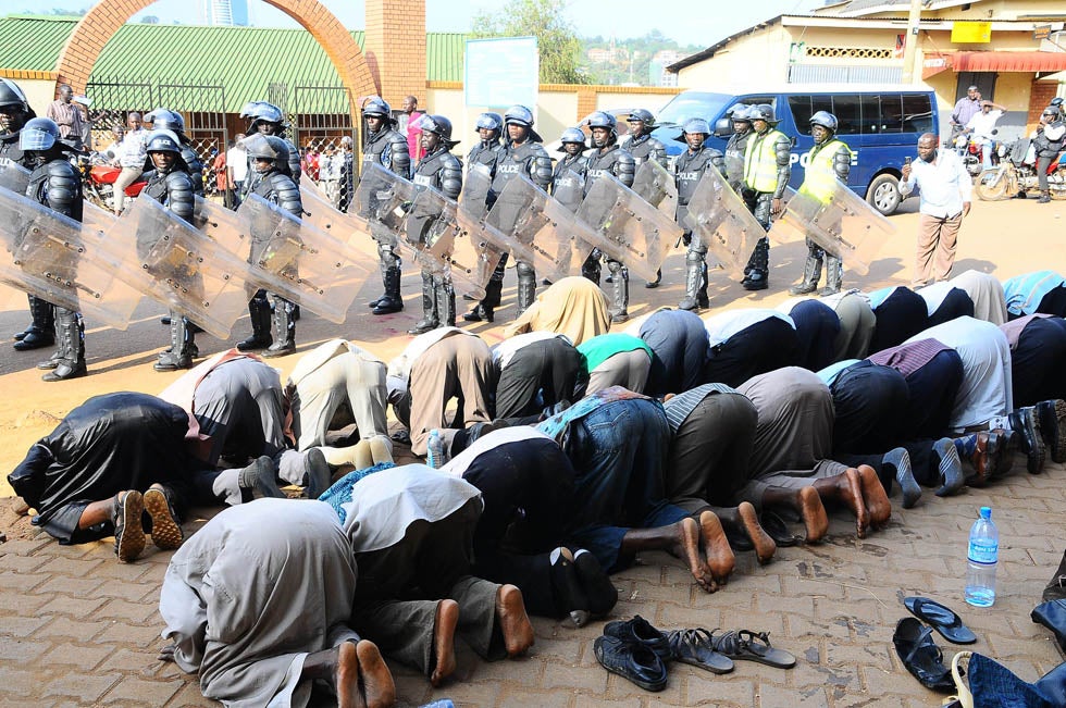 Muslim protestors pray near Ugandan anti-riot police on the streets of Kampala. Kasamani Isaac is a photojournalist based in Uganda who works for the <a href="http://www.monitor.co.ug/"><em>Daily Monitor</em></a>, the leading independent paper in the region. He is also a stringer for Getty Images.