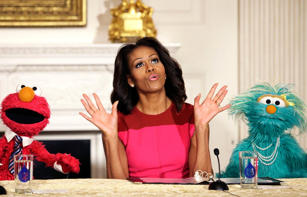 U.S. first lady Michelle Obama reacts between PBS Sesame Street characters Elmo and Rosita after delivering remarks on marketing healthier foods to children at the White House. Yuri Gripas is a reuters staffer based in Washington DC; he primarily covers political news.