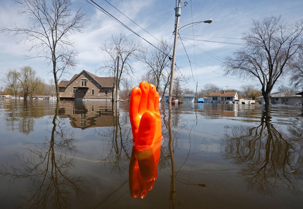 A rubber glove being used as a marker bobs in the water after heavy flooding in Fox Lake, Illinois. Jim Young is a US-based Reuters staffer covering breaking and general news. See more of his work <a href="http://www.americanphotomag.com/photo-gallery/2012/09/photojournalism-week-september-14-2012-0">here</a>.