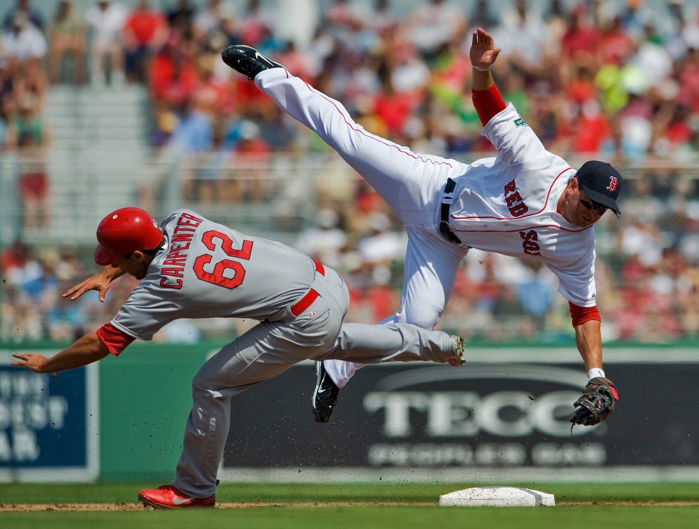 This impressive high-speed fast-shutter image, captured during a Red Sox vs Cardinals spring training game, was shot by Reuters photographer Steve Nesius. A former photo editor for the Associated Press, Nesius now covers a wide range of photographic assignments in the Tampa Bay-area for a variety of clients, including Reuters.