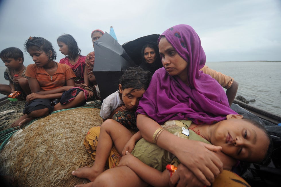 Rohingya Muslims, trying to cross the Naf River into Bangladesh to escape sectarian violence in Myanmar, look on from an intercepted boat. Despite growing calls for the border to be opened, Bangladeshi guards have turned back 16 boats carrying more than 660 Rohingya people, most of them women and children, since June 11. Munir Uz Zaman is a freelancer based in Bangladesh. Check out more of his work in our previous <a href="http://www.americanphotomag.com/photo-gallery/2012/04/photojournalism-week-april-20-2012?page=8">Photojournalism of the Week Gallery</a>.