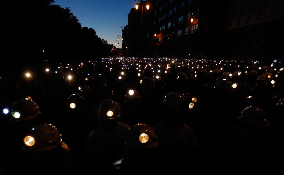 Spanish coal miners turn their helmet lamps on in the streets of Leon, Spain, as part of a nation-wide protest against subsidy reductions. Cesar Manso is an AFP stringer and commercial shooter based in Spain. Check out more of his work over on his <a href="http://www.cesarmanso.com/">Website</a>.