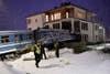 Police officers stand near a local train that derailed and crashed into a residential building in Saltsjobaden outside Stockholm. Jonas Ekstromer is a Swedish-based photojournalist shooting for Scanpix.