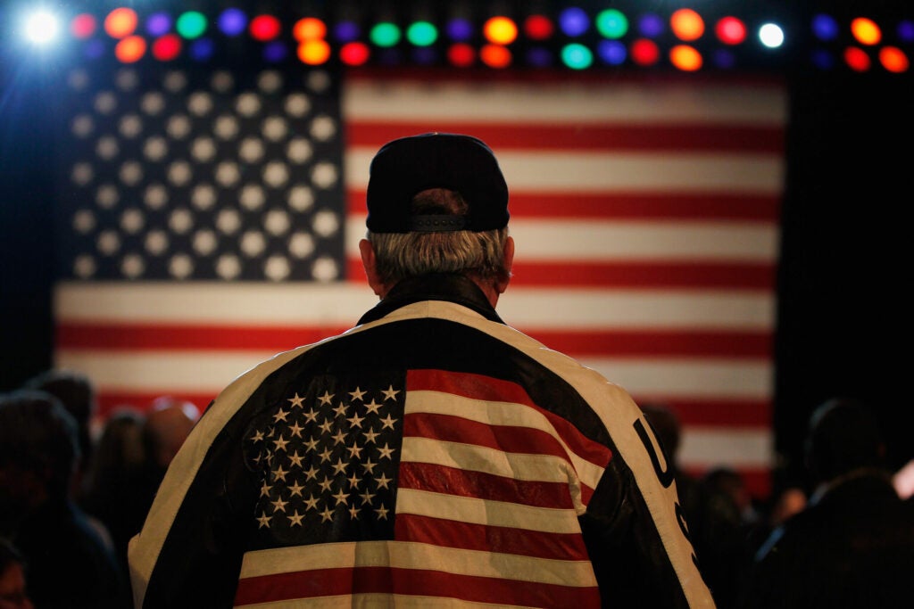 Getty Images staff photographer Joe Raedle made this image of a Mitt Romney supporter during a campaign event held before the Michigan primary. Raedle has been on the ground covering several wars for Getty. In March of 2011 he was taken captive while covering the war in Libya, by Gaddafi forces. He was imprisoned for four days before being released.