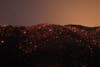 A smouldering mountainside is seen under the stars at the Silver Fire near Banning, California August 7, 2013. The fire broke out shortly after 2 p.m. near a back-country road south of Banning, about 90 miles (145 km) outside Los Angeles in Riverside County, and within hours had blackened more than 5,000 acres, California Department of Forestry and Fire Protection spokesman Daniel Berlandt said.  REUTERS/David McNew  (UNITED STATES - Tags: DISASTER TPX IMAGES OF THE DAY) - RTX12DJX