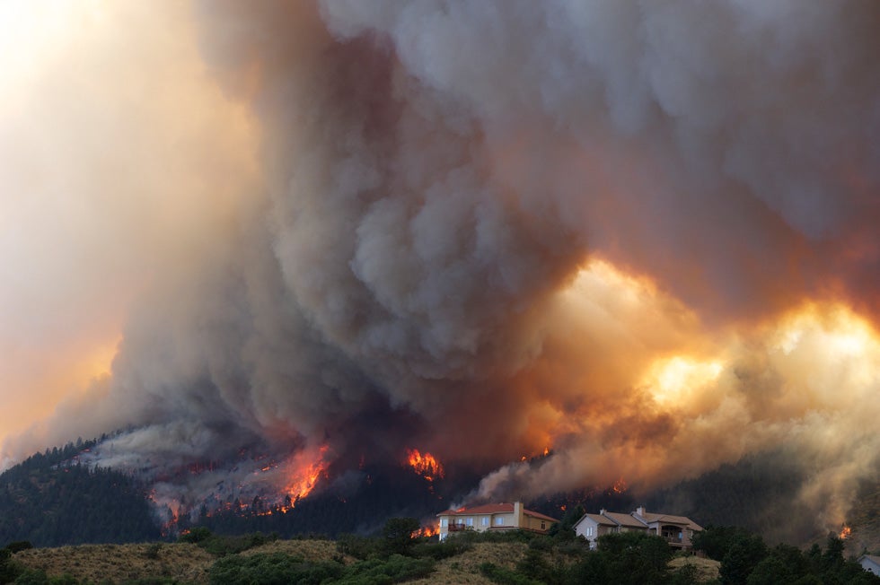 Fire from the Waldo Canyon wildfire burns as it moves into subdivisions and destroys homes in Colorado Springs. Gaylon Wampler is a freelance photographer working for the Associated Press in Colorado. Formally a <em>Denver Post</em> staffer, and before that, a photographer at <em>The Houston Post</em>, Gaylon now owns a <a href="http://gaylonwamplerphotography.com/view_product.php?cat_id=3&amp;product=FA01">commercial photography business</a>.