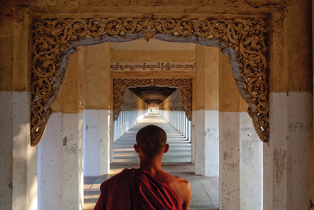 A novice monk on his way to collect offerings