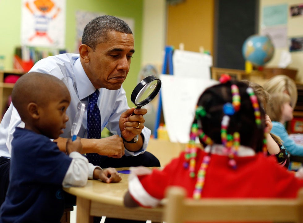 U.S. President Barack Obama uses a magnifying glass to play a game with children in a pre-kindergarten classroom at College Heights early childhood learning center in Decatur, Georgia. Jason Reed is a Reuters staffer who covers President Obama. See more of his work <a href="http://www.americanphotomag.com/photo-gallery/2012/09/photojournalism-week-september-28-2012?page=4">here</a>.