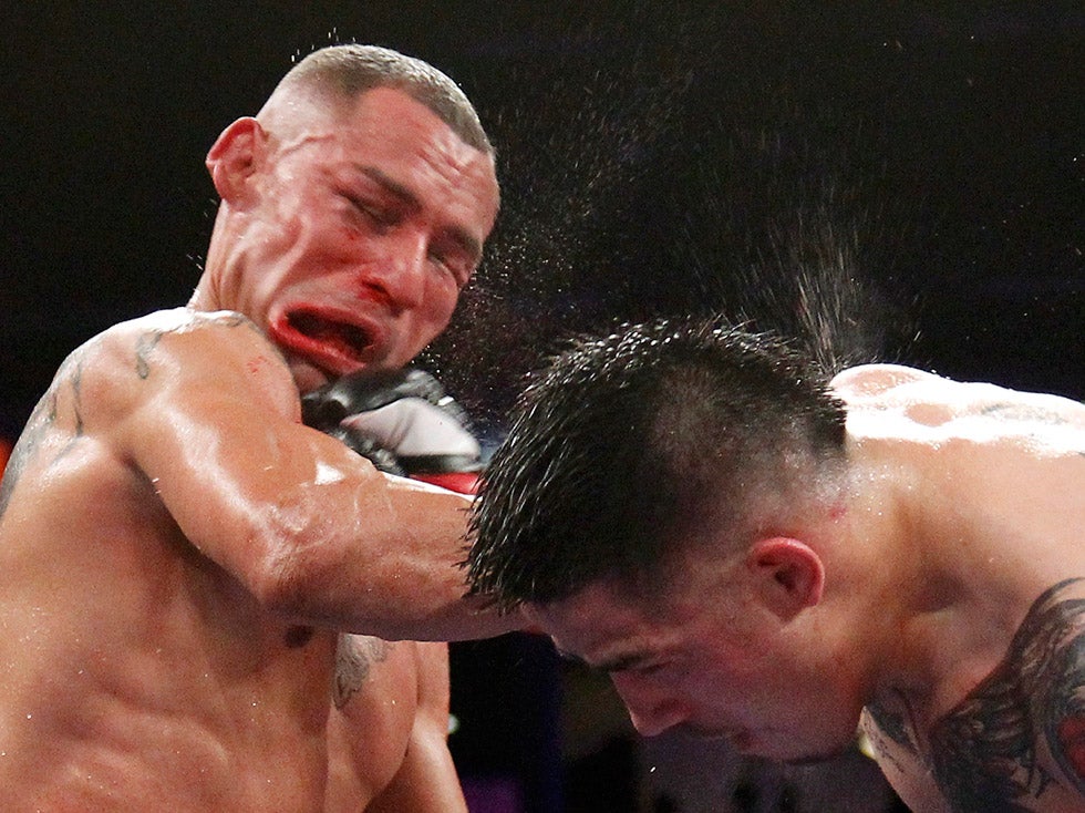 Brandon Rios (R) of the U.S. connects to the face with a punch on compatriot Mike Alvarado during the sixth round of their WBO Latino Super Lightweight Title boxing match in Carson, California. Rios won by TKO in the seventh round. Danny Moloshok is a fulltime commercial photographer working for Reuters. See more of his work on his <a href="http://www.molophoto.com/">site</a>.