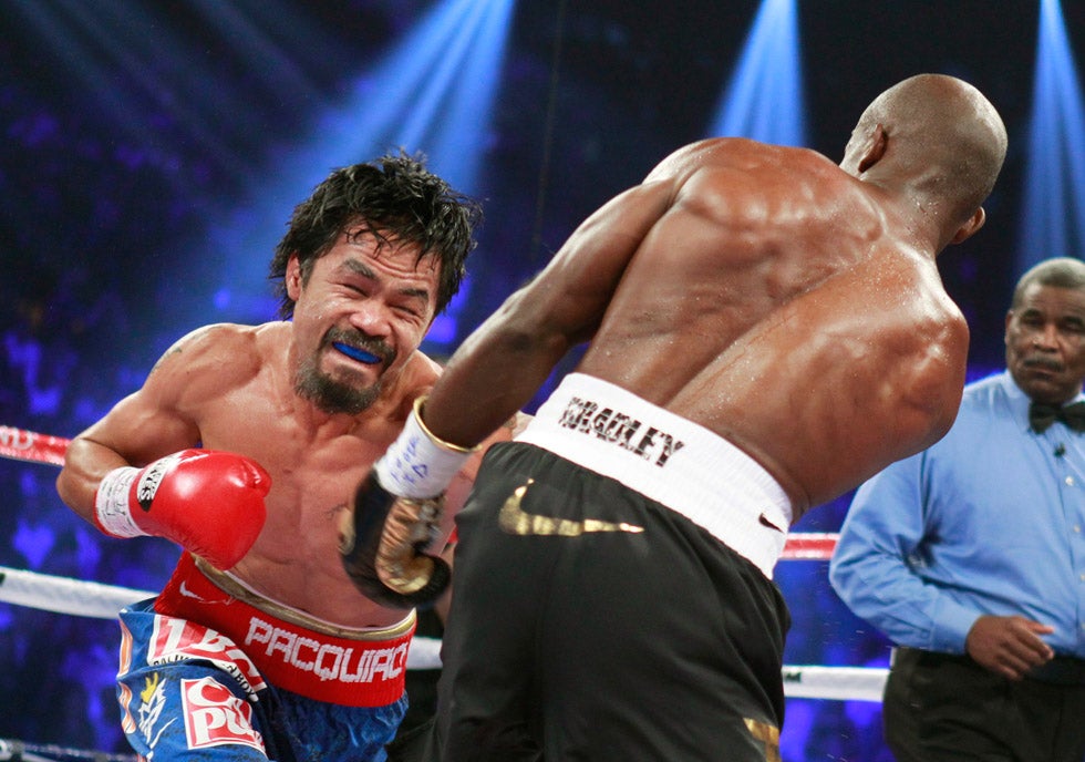 WBO welterweight champion Manny Pacquiao of the Philippines punches at Timothy Bradley Jr. of the U.S. during their title fight at the MGM Grand Garden Arena in Las Vegas. Photographer Steve Marcus is Reuters's most experienced boxing photographer, having shot more title bouts than nearly anyone else at the company. Read a little bit more about his boxing images over on the <a href="http://blogs.reuters.com/photographers-blog/2012/02/06/the-fight-of-their-lives/">Reuters blog</a>.