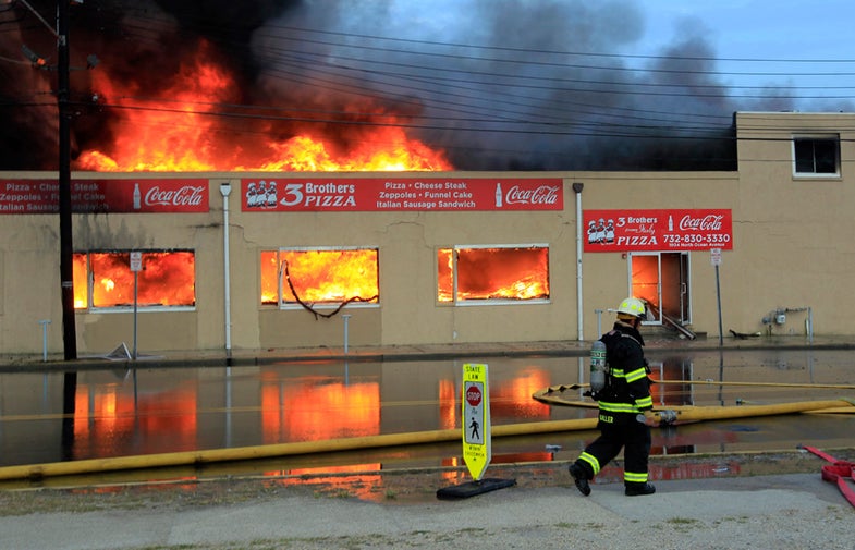 Three Brothers Pizza is consumed is a fast moving fire consumes by fire which began earlier in the day at the south end of the Seaside Boardwalk. 9/12/2013 (Andrew Mills/The Star-Ledger)