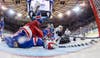 New York Rangers defenseman Dan Girardi (5) trips over goalie Henrik Lundqvist as he reaches to clear the puck from the goal line as Los Angeles Kings right wing Marian Gaborik tries to score in the third period during Game 3 of the NHL hockey Stanley Cup Final, Monday, June 9, 2014, in New York. The Kings won 3-0. Bruce Bennett has been photographing hockey since 1974. More of his work can be seen <a href="http://www.brucebennettstudios.com/">here. </a>