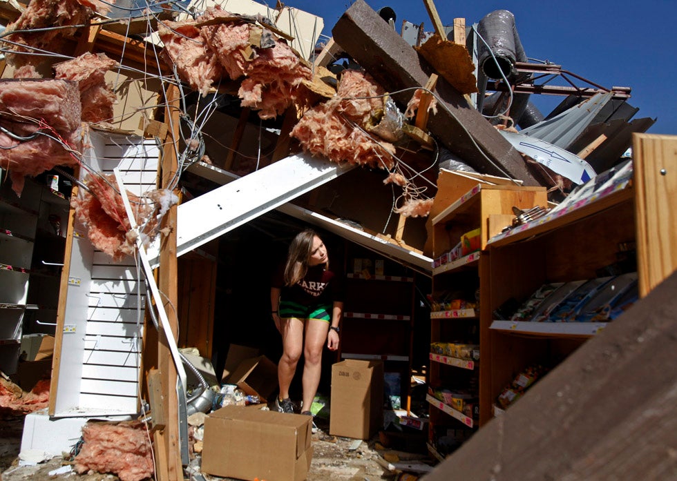 Reuters contract-photographer Sarah Conard made this photograph of Carissa Westfall searching her Branson, Missouri health food store, for anything salvageable. Earlier in the week a Tornado ripped through the Midwest, killing at least six people and damaging many buildings. Check out more of Sarah's work on her <a href="http://www.sarahconard.com/#">Website</a>.