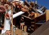 Reuters contract-photographer Sarah Conard made this photograph of Carissa Westfall searching her Branson, Missouri health food store, for anything salvageable. Earlier in the week a Tornado ripped through the Midwest, killing at least six people and damaging many buildings. Check out more of Sarah's work on her <a href="http://www.sarahconard.com/#">Website</a>.