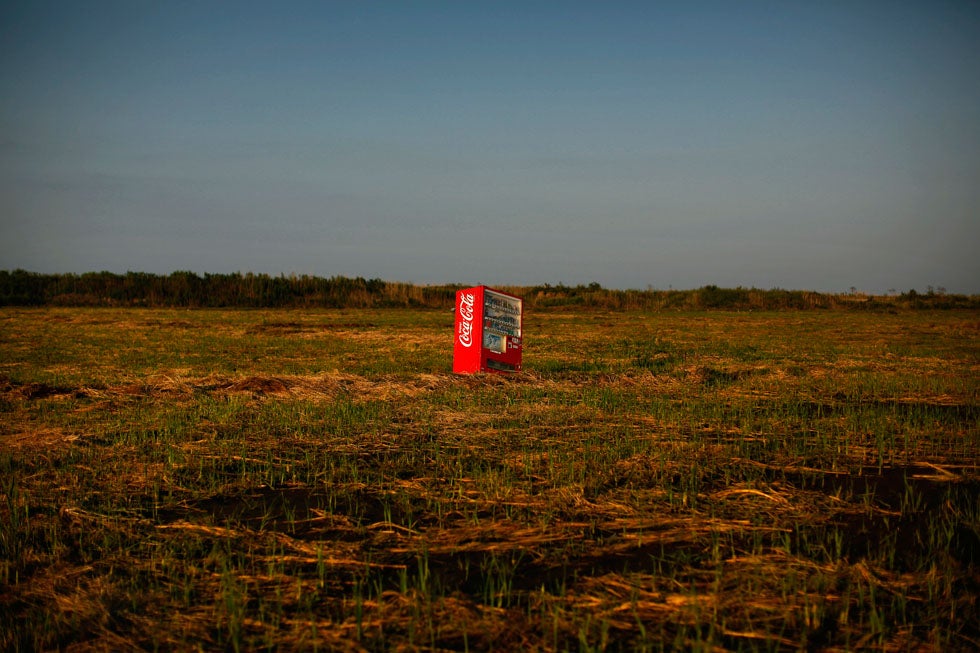 A vending machine, brought inland by a tsunami, is seen in a abandoned rice field inside the exclusion zone at the coastal area near Minamisoma in Fukushima prefecture. Damir Sagolj is a Reuters staff photographer based in Myanmar. He recently won first prize in the World Press Photo "Daily Life Singles" category. Check out his awesome blog over on the <a href="http://blogs.reuters.com/damir-sagolj/">Reuters site</a>.