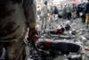 A paramilitary soldier stands guard at the scene of a bomb explosion in Quetta, Pakistan. The bomb exploded in a crowded market, killing 11 and injuring 40. A local militant group claimed responsibility. Naseer Ahmed is a Pakistan-based photojournalist shooting for Reuters.