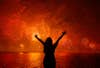 A woman celebrates the New Year as she watches fireworks exploding above Copacabana beach in Rio de Janeiro. Pilar Olivares is a Reuters staffer based in Brazil. See more of his work on his <a href="http://pilarolivares.photoshelter.com/">site</a>.