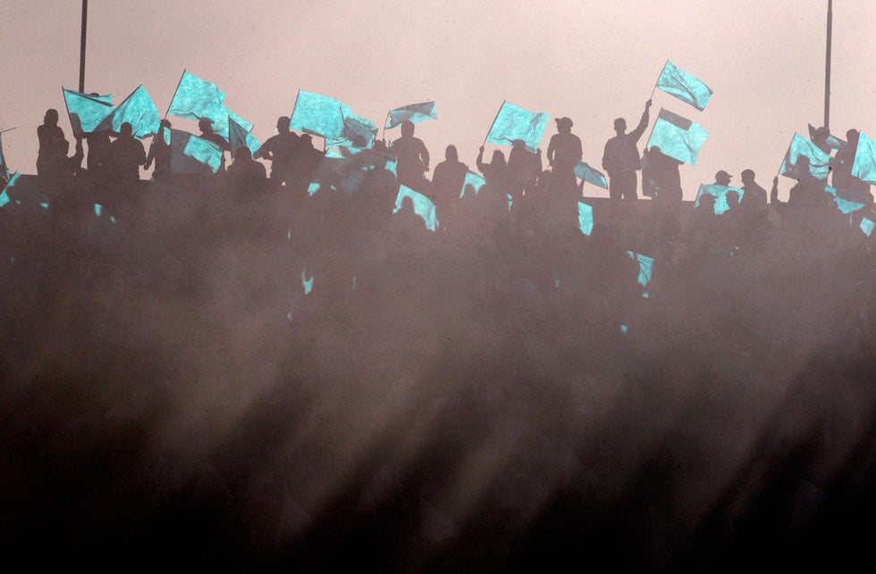 Supporters of Club Nacional de Football cheer amidst smoke from fireworks, before the start of a match against Penarol in Montevideo, Uruguay. Andres Stapff is a Reuters staffer based in Uruguay covering general news.