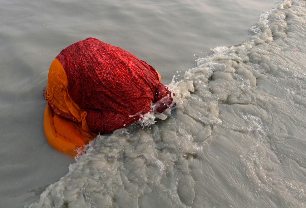A Hindu pilgrim takes a dip at the confluence of the Ganges river and the Bay of Bengal at Sagar Island, India. Rupak De Chowdhuri is an India-based Reuters photographer. Check out more of his work <a href="http://www.americanphotomag.com/photo-gallery/2012/11/photojournalism-week-november-16-2012?page=3">here</a> and <a href="http://www.americanphotomag.com/photo-gallery/2012/11/photojournalism-week-november-9-2012?page=8">here</a>.