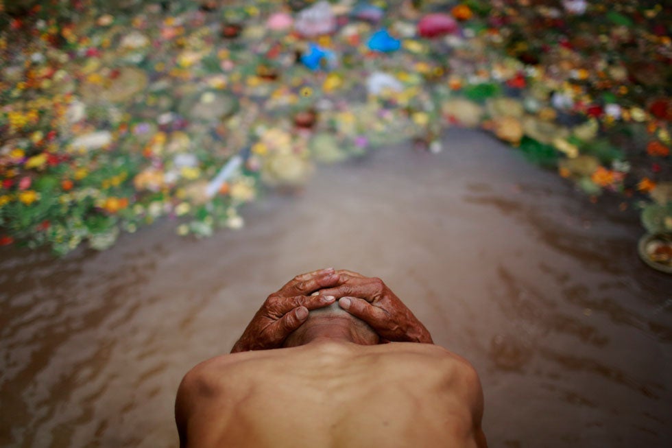 A man takes a holy bath at Matathirtha in Kathmandu, to celebrate Mother's Day. It's tradition that families who have lost their mothers take a holy wash and offer prayer each year on Mother's Day. Navesh Chitrakar is a Reuters staffer based in Nepal. You can see more of his incredible work in our past round-ups <a href="http://www.americanphotomag.com/photo-gallery/2013/04/photojournalism-week-april-26-2013?page=4">here</a> and <a href="http://www.americanphotomag.com/photo-gallery/2012/08/photojournalism-week-august-17-2012?page=9">here</a>.