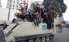 Protesters sit atop a military vehicle during demonstrations in Cairo January 29, 2011. Thousands of angry Egyptians rallied in central Cairo on Saturday to demand that President Hosni Mubarak resign, dismissing his offer of dialogue and calling on troops to come over to their side. Asmaa Waguih is a Reuters staffer currently based in Egypt. Like many of his other peers featured here, Asmaa is no stranger to violence. Take a look at his previous work documenting the frontlines of Syria <a href="http://www.reuters.com/news/pictures/slideshow?articleId=USRTR3EO44#a=1">here</a>, and see more from Egypt <a href="http://www.americanphotomag.com/photo-gallery/2013/04/photojournalism-week-april-26-2013?page=1">here</a>.