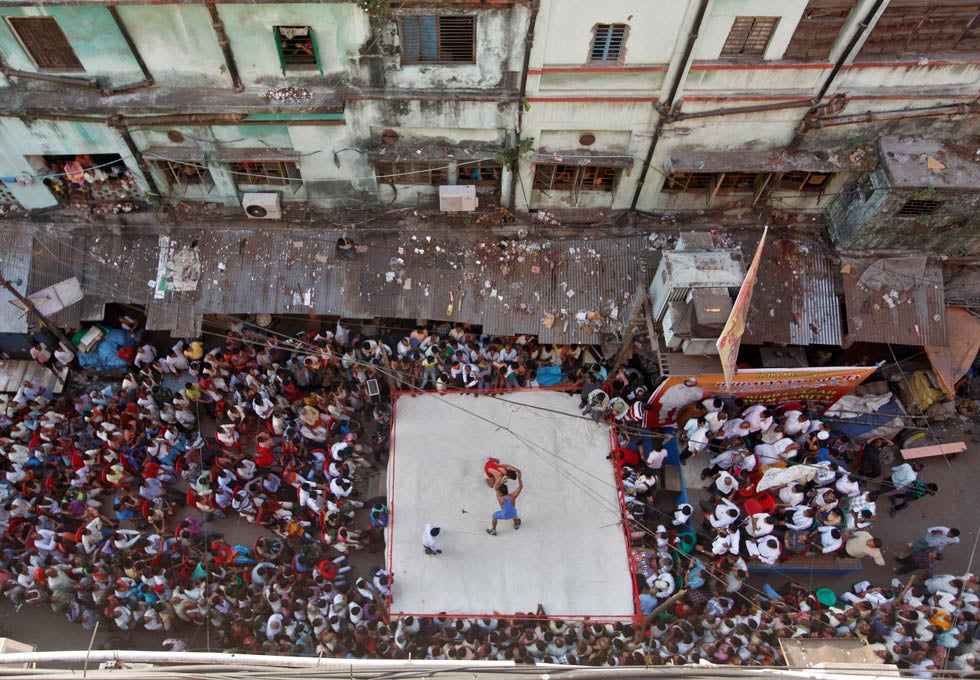 Two wrestlers fight during an amateur wrestling match inside a makeshift ring in Kolkata, India. Wrestling matches are organized by local residents as part of the celebrations for the annual Hindu festival of Diwali. Rupak De Chowdhuri is an India-based Reuters photographer. Check out his work in <a href="http://www.americanphotomag.com/photo-gallery/2012/11/photojournalism-week-november-9-2012?page=8">last week's roundup</a> as well.