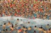 Visitors crowd in an artificial wave pool at a water park in Nanning, Guangxi Zhuang, China.