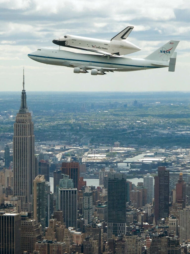 The Space Shuttle Enterprise made its grand entrance into the New York City-area, atop a custom 747 jet, on Friday, April 27. Its new home is the Intrepid Sea, Air and Space Museum. Robert Markowitz is a NASA scientific photographer, based out of the Johnson Space Center—he has been shooting for the Space Administration for over 20 years. Markowitz made this incredible image from aboard a NASA T-38 Talon jet.
