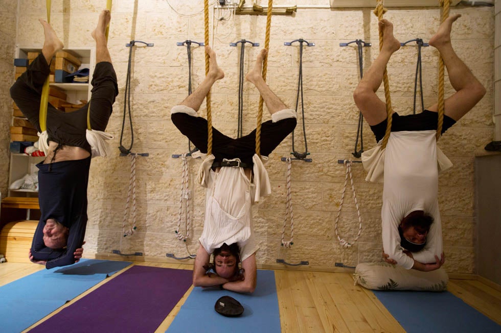 Ultra-Orthodox Jewish men take part in a yoga class at a studio in Ramat Beit Shemesh 12 mile from Jerusalem, Israel. Ronen Zvulun has been working in Israel since 1996 as a photojournalist. He has been with Reuters since 2007. See more of his work on <a href="http://www.lightstalkers.org/ronen">Lightstalkers</a>.