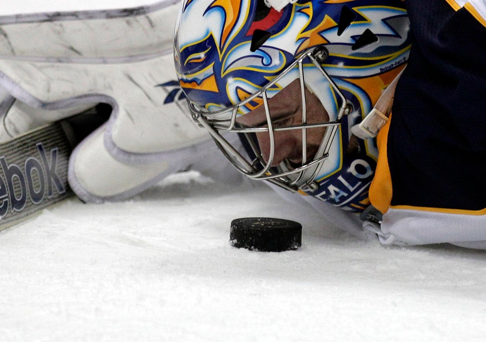 Associate press Photographer Gregory Bull captured this photo of Buffalo Sabres goalie Ryan Miller staring at a puck he had just stopped during an NHL game against the Anaheim Ducks. Bull has been shooting for the Associated press since 1996, and has worked in Mexico, Japan, Haiti and all over the United States.