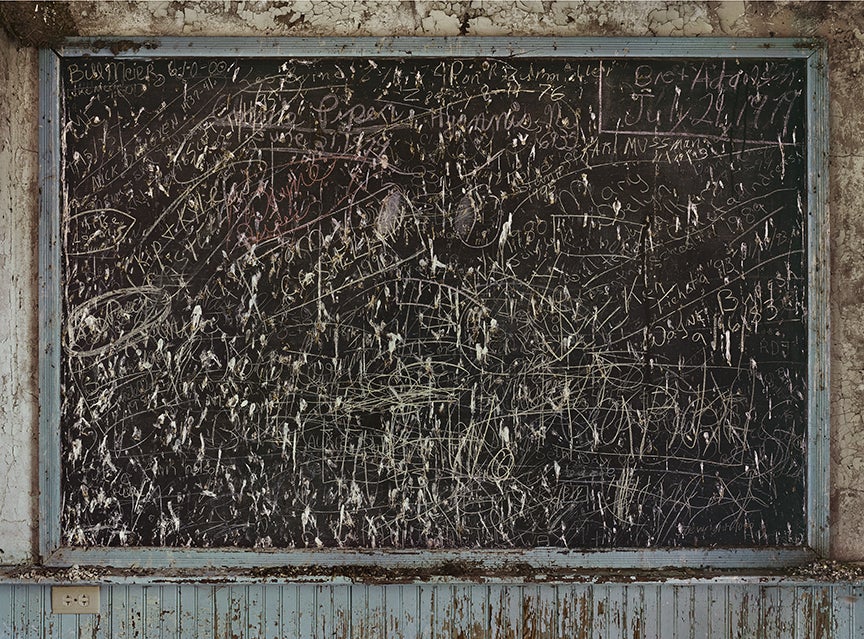 This blackboard is from a tiny rural school that served ranching families whose names can still be seen written on the board. This type of school, known as class-one, has been closed in recent years throughout the state; this one operated until 1966.