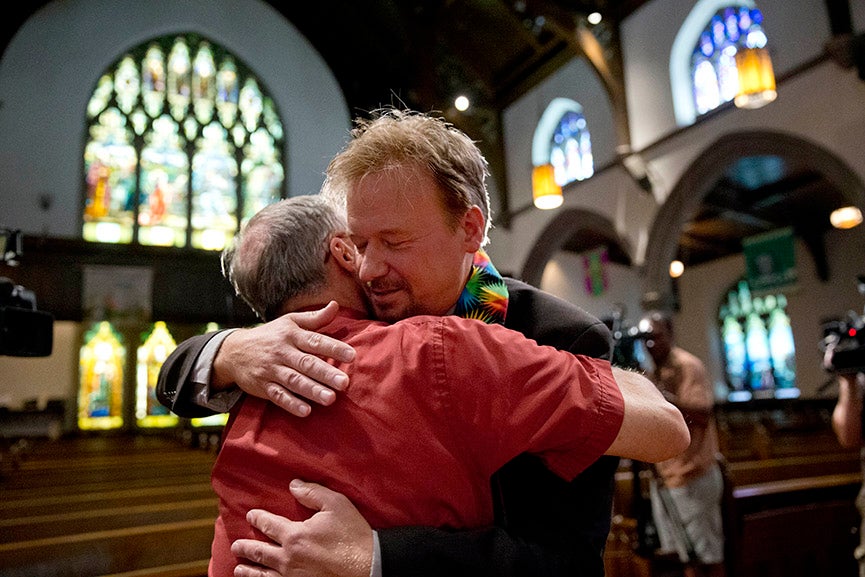 United Methodist pastor Frank Schaefer, right, hugs the Rev. David Wesley Brown after a news conference Tuesday, June 24, 2014, at First United Methodist Church of Germantown in Philadelphia. Schaefer, who presided over his son's same-sex wedding ceremony and vowed to perform other gay marriages if asked, can return to the pulpit after a United Methodist Church appeals panel on Tuesday overturned a decision to defrock him. Matt Rourke is an Associated Press Staff Photographer based in Philadelphia. More of his work can be seen <a href="http://bigstory.ap.org/tags/matt-rourke">here. </a>