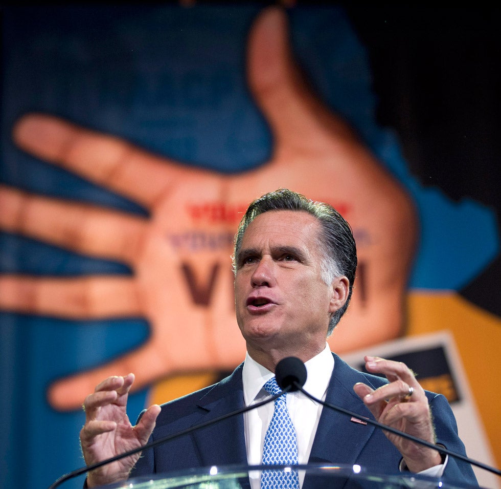 Republican presidential candidate, Mitt Romney gestures during a speech at the NAACP annual convention. Evan Vucci is an Associated Press staff photographer. Check out more of his work on his <a href="http://www.evanvucci.com/">personal site</a>, and keep up to date with his assignments by following his <a href="http://twitter.com/evanvucci">Twitter</a>.