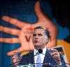 Republican presidential candidate, Mitt Romney gestures during a speech at the NAACP annual convention. Evan Vucci is an Associated Press staff photographer. Check out more of his work on his <a href="http://www.evanvucci.com/">personal site</a>, and keep up to date with his assignments by following his <a href="http://twitter.com/evanvucci">Twitter</a>.