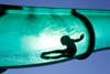 A boy slides down a water chute in a public swimming pool in Thun August 1, 2013. REUTERS/Ruben Sprich  (SWITZERLAND - Tags: ENVIRONMENT SOCIETY TPX IMAGES OF THE DAY) - RTX1274L