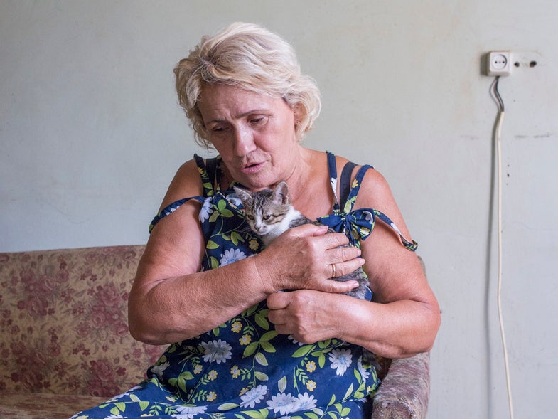 Marie, 70, lives in the govdernment-assisted shelter Collective Center after fleeing shelling in the east. "This kitten is named Mariska. She heals me by taking away bad energy."