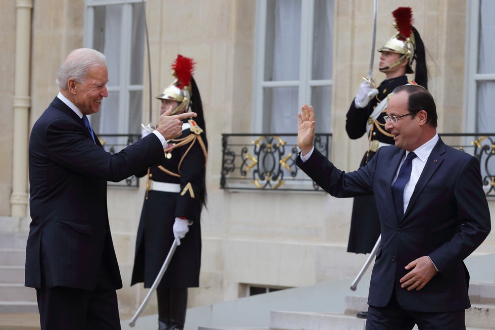France's President Francois Hollande waves goodbye to U.S. Vice President Joe Biden after a working lunch and joint news conference at the Elysee Palace. Philippe Wojazer is a Reuters photographer based in Paris.