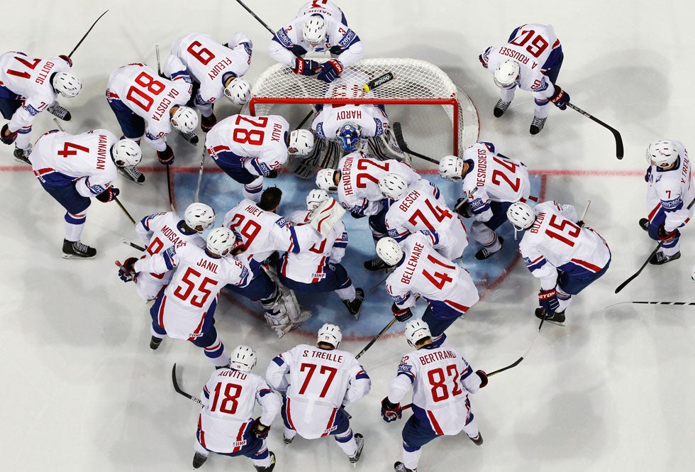 Players from France's national ice hockey team huddle in front if their goal before the start of the Ice Hockey World Championship preliminary round game against Russia. Grigory Dukor is a Reuters staffer based in Finland. See more of his work in our past round-up <a href="http://www.americanphotomag.com/photo-gallery/2012/08/photojournalism-week-august-3-2012?page=2">here</a>.