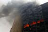 The building of the ruling National Democratic party burns after it was set ablaze by protesters. Egyptian President Hosni Mubarak refused on Saturday to bow to demands that he resign after ordering troops and tanks into cities in an attempt to quell an explosion of street protests against his 30-year rule. Yannis Behrakis is a Reuters staffer who is no stranger to protests. Check out some of his other work covering the upheaval in Turkey earlier this summer <a href="http://www.americanphotomag.com/photo-gallery/2013/06/turkish-protests-photos-so-far?page=7">here</a>.