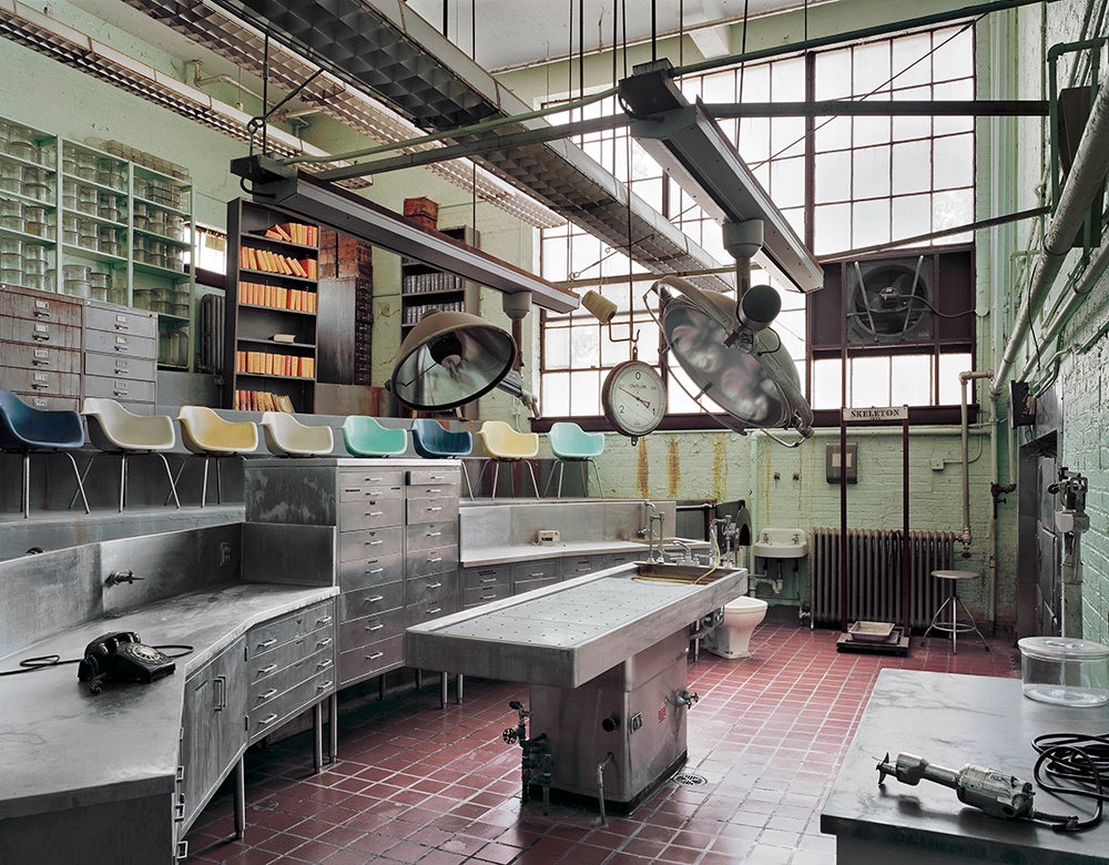 "This is my favorite space of the many that I photographed. It’s an autopsy theater and morgue located in an isolated area in the building’s basement. It was in perfect condition, because the upper floors of the building were still in use so the basement was heated. One advantage to gaining permission to photograph these spaces, is that you’re often accompanied by a guide who really knows the place. When he or she has worked there for 30 years, they often love to show you the facility’s hidden treasures."