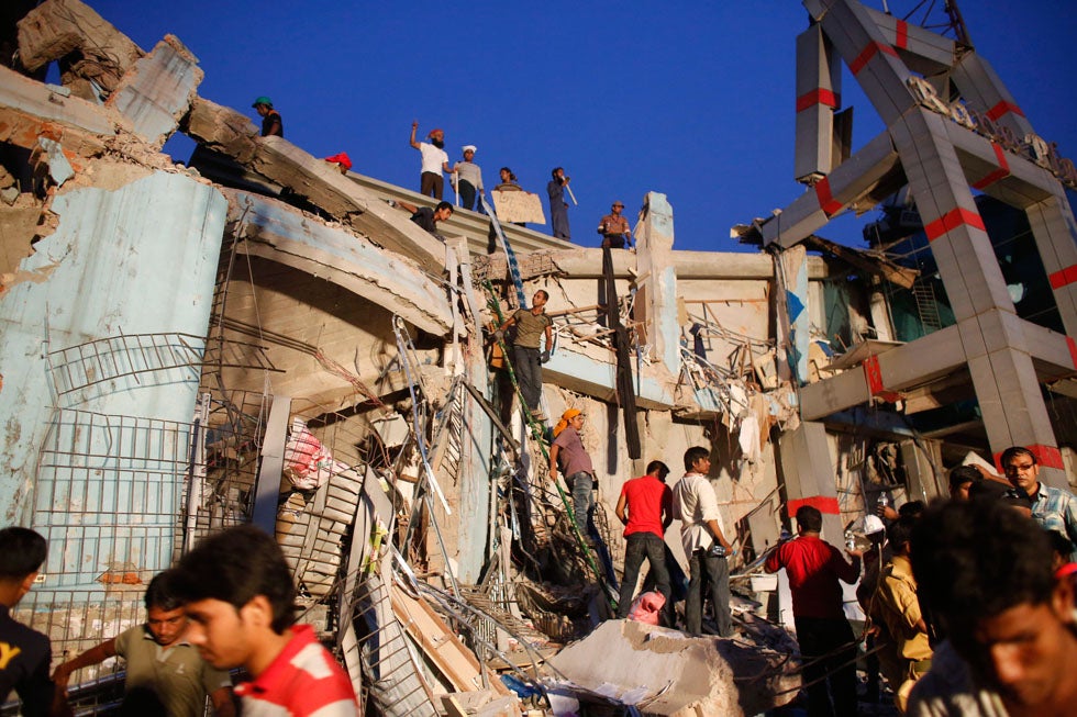 Responders try to rescue trapped garment workers from the Rana Plaza building, which collapsed earlier in the week, on the outskirts of Dhaka, Bangladesh. The accident killed upwards of 228 people and injured thousands more. Andrew Biraj is a Reuters staff photographer based out of Dhaka, Bangladesh and the winner of a 2011 World Press Photo award. See more of his work <a href="http://www.americanphotomag.com/photo-gallery/2013/01/photojournalism-week-january-25-2013?page=8">here</a>.