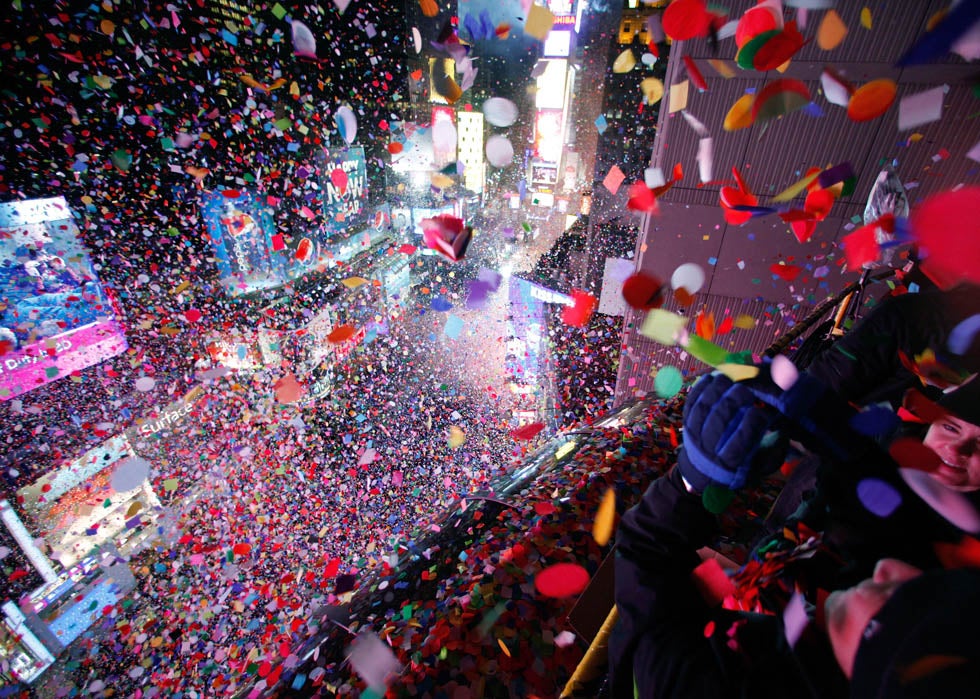 Confetti is dropped on revelers at midnight during New Year celebrations in Times Square in New York. Gary Hershorn is a 28-year Reuters veteran from Hoboken, New Jersey. See more of his incredible work <a href="http://blogs.reuters.com/gary-hershorn/">here</a>.