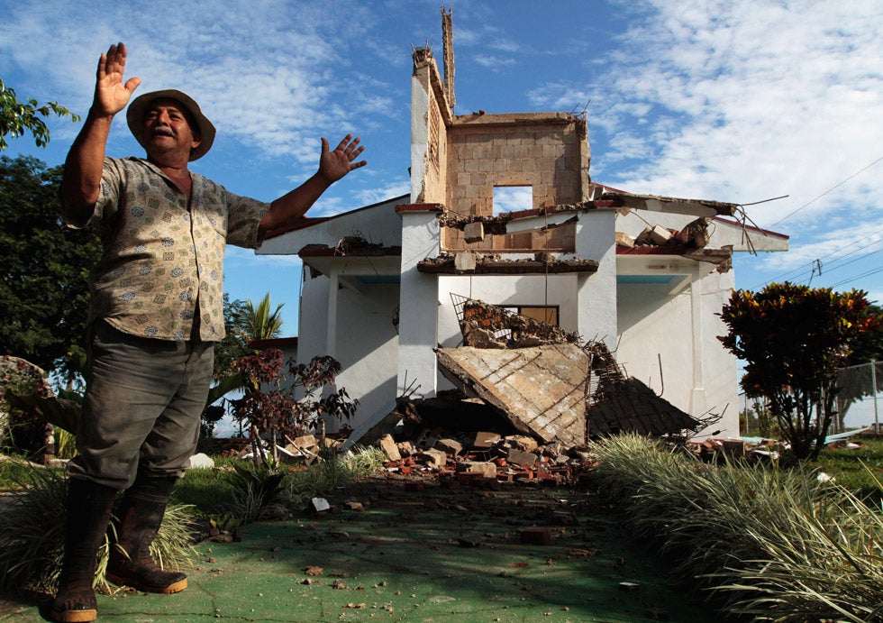 A resident of Bella Vista town stands outside the church destroyed by an earthquake in Nicoya, Costa Rica. Oswaldo Rivas is based in Nicaragua and has been a photographer with Reuters since 1997. See more of his work in our <a href="http://www.americanphotomag.com/photo-gallery/2012/07/photojournalism-week-july-27-2012?page=2">past round-up</a>.