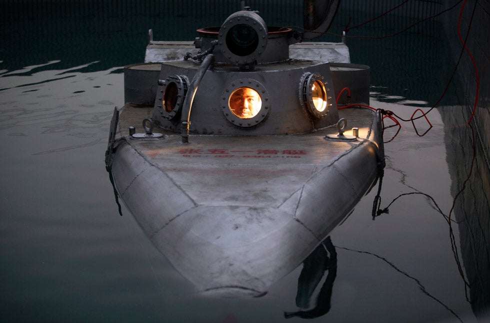 Zhang Wuyi sits in his homemade two-seat submarine during a test operation at an artificial pool in Wuhan, Hubei province, China. A 37-year old farmer, Wuyi has built a total of six mini-subs and recently sold one for 100,000 yuan ($15,855). Darley Shen is a stringer for Reuters working in Eastern of China.