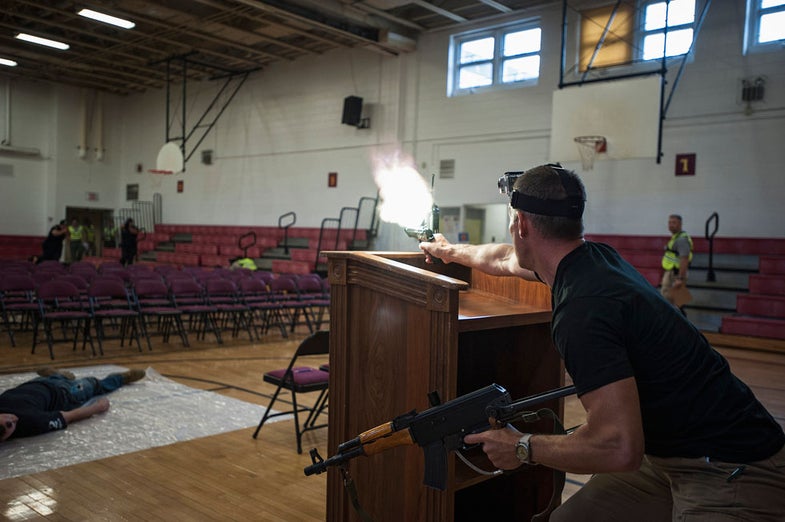 Rick Scott of security contractor Camber Corp impersonates a hostile shooter during a training exercise at Quantico Middle High School in Quantico, Virginia May 9, 2013. REUTERS/James Lawler Duggan (UNITED STATES - Tags: CRIME LAW TPX IMAGES OF THE DAY) - RTXZGXE
