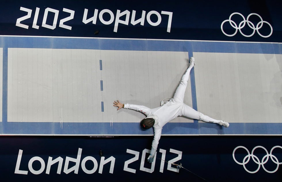 South Korea's Jinsun Jung celebrates his victory against Seth Kelsey of the U.S. at the end of their men's epee individual bronze medal fencing match. Fabrizio Bensch is a German-based photojournalist who began his career in 1989 when the Berlin Wall first came down. He has been working with Reuters since 2002. See more of his work on his personal <a href="http://fabriziobensch.com/">site</a>.