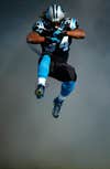 Carolina Panthers running back DeAngelo Williams jumps in the air as he is introduced before playing the Denver Broncos during an NFL football game in Charlotte, North Carolina. Chris Keane is a freelance photographer, based in North Carolina, shooting for Reuters. See more of his work on his <a href="http://www.chriskeane.com/">site</a>.