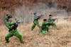 North Korean soldiers with weapons attend military training in an undisclosed location in this picture released by the North's official KCNA news agency.