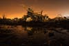 A car rests on top of a pile of debris pushed up by the wind in an area heavily damaged by the May 20 tornado in Moore, Oklahoma. Read the story behind this image in our <a href="http://www.americanphotomag.com/photo-gallery/2013/05/lucas-jacksons-long-exposures-oklahoma-aftermath">exclusive interview with Lucas Jackson.</a>