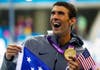 Michael Phelps of the U.S. holds his 19th Olympic medal presented to him in the men's 4x200m freestyle relay victory ceremony. Michael Dalder is a Reuters photographer covering all of the swimming events at the 2012 London Olympics.